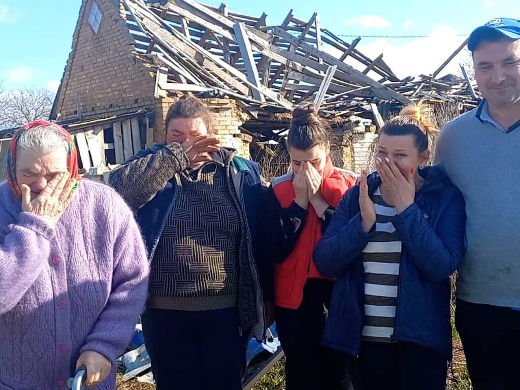 family cries when learns that it will receive a modular home from the charity